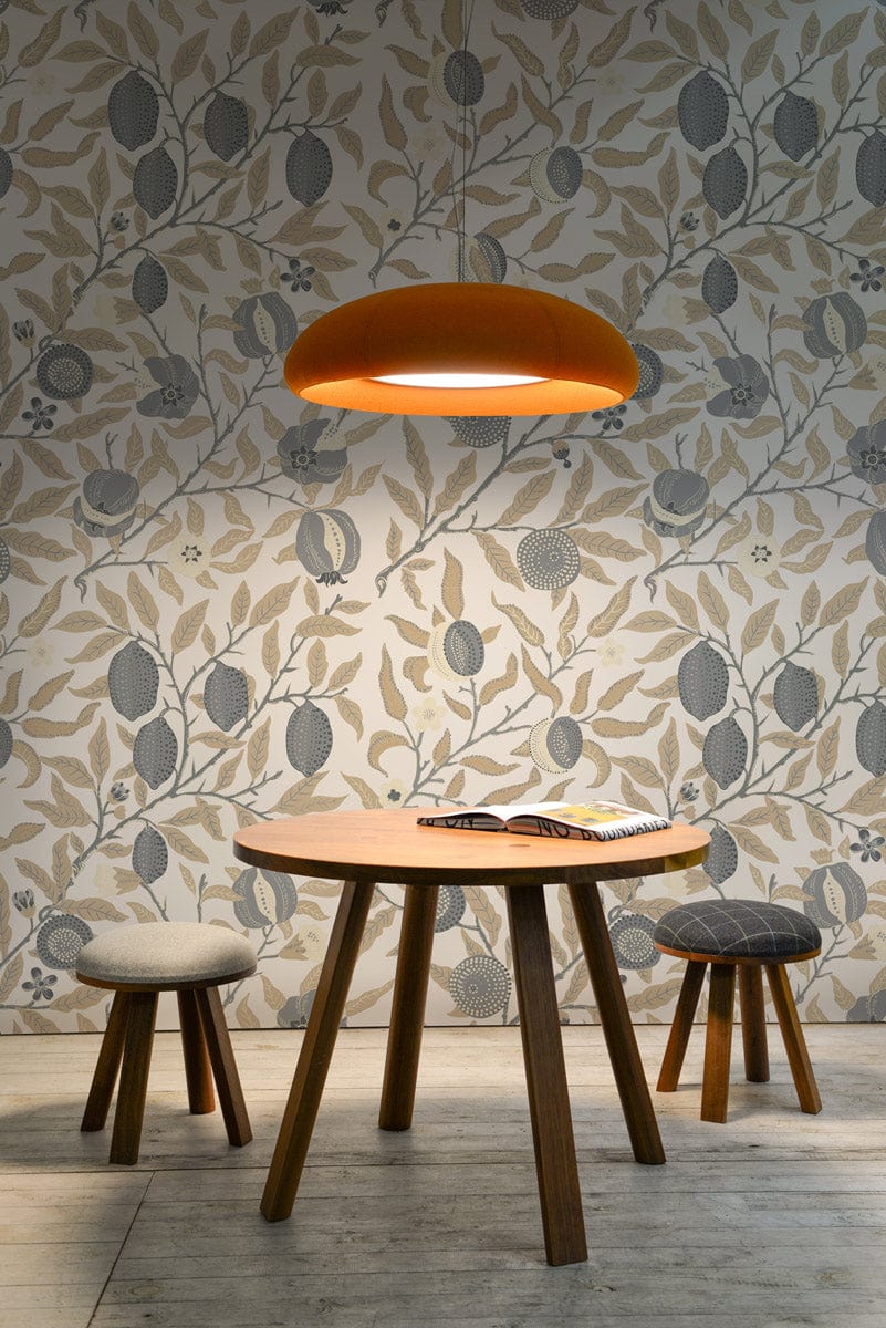 Elegant grey and beige floral wallpaper in stylish room with round table, stools, wooden flooring.