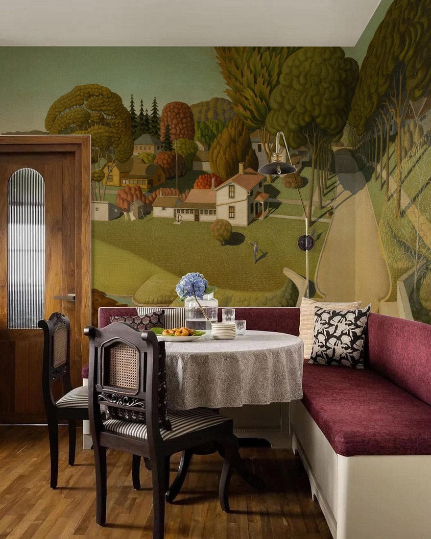 Vintage countryside mural wallpaper in dining room with wooden floor, classic chairs, and burgundy bench.