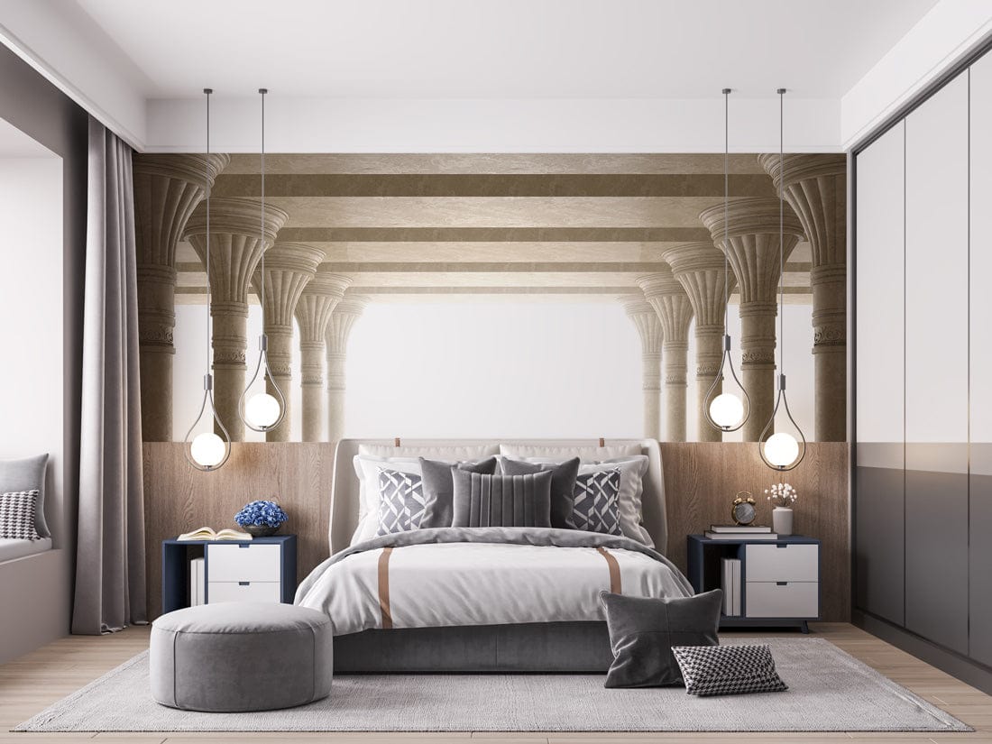 Classic cream stone column mural wallpaper in elegant bedroom with grey bed, pendant lights, wooden flooring.
