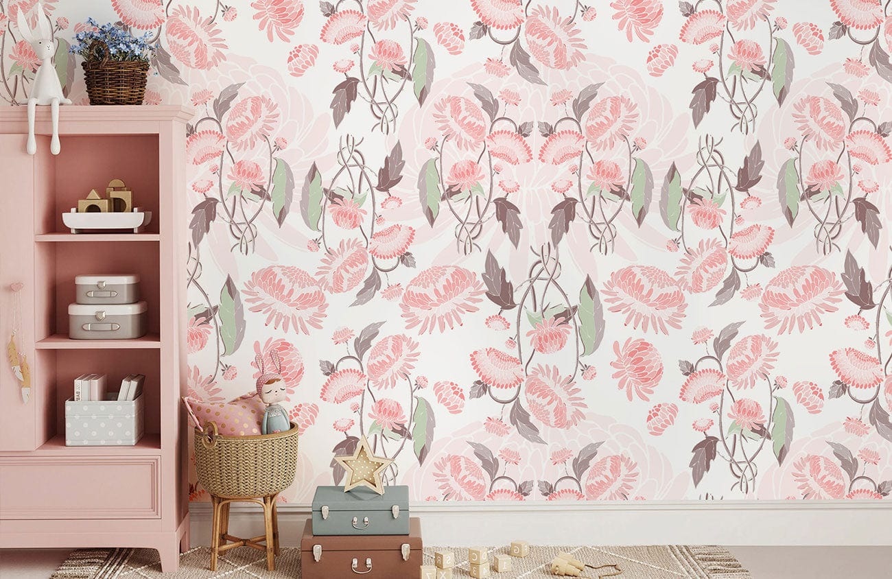 Elegant vintage floral wallpaper in soft pink and green tones with pink shelving and wicker basket.