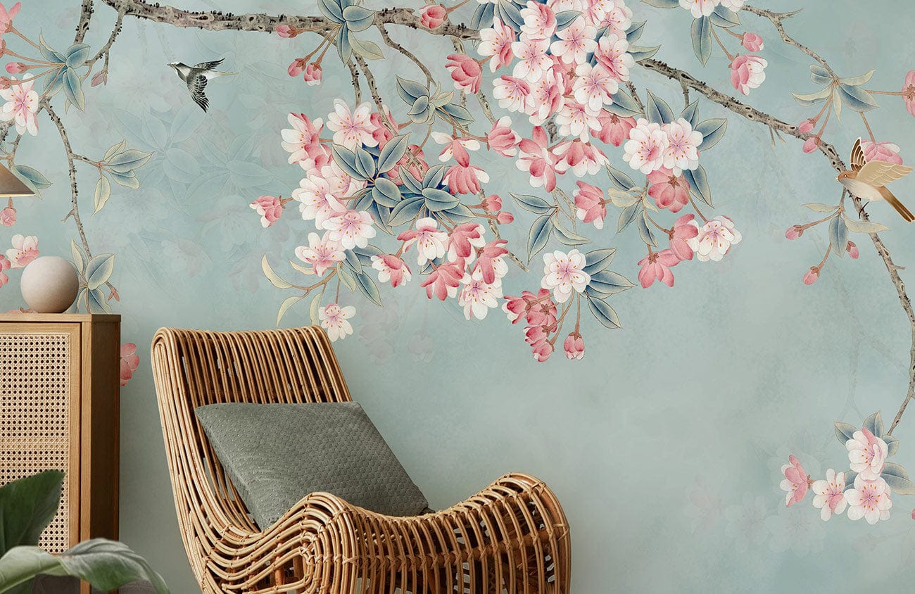 Blossoming cherry tree mural in pastel hues, rattan chair, soothing room ambiance, elegant wall art.