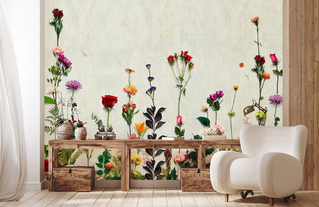 Beautiful vibrant floral garden mural wallpaper in pastels, wooden furniture, cream chair, wooden flooring.