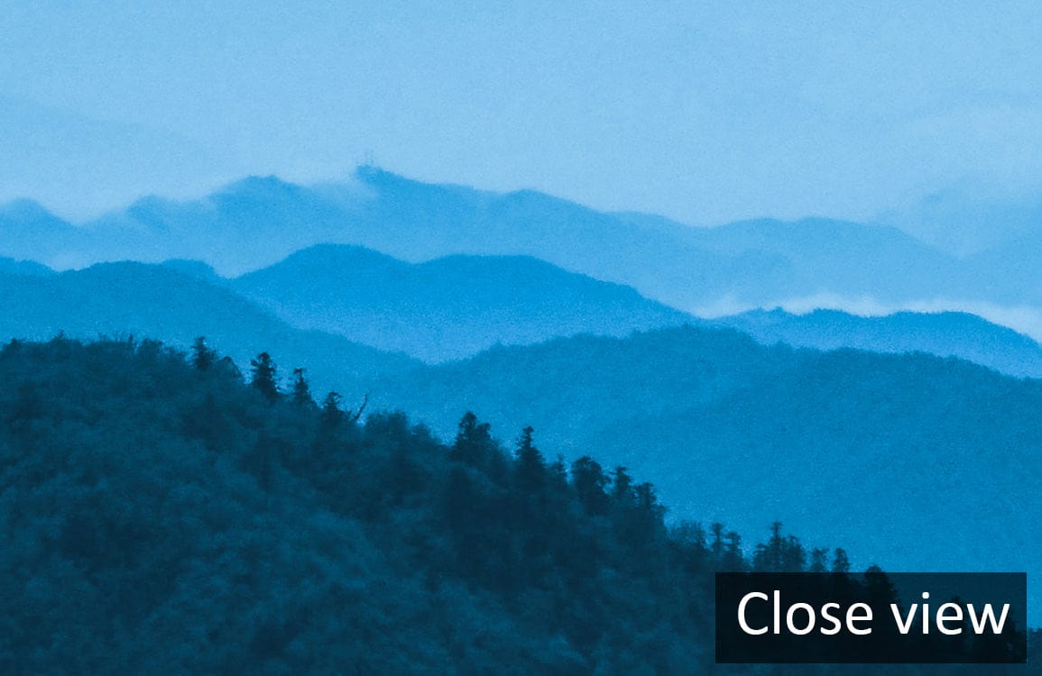 Close view of Serene Blue Mountain Mist Scenic Mural Wallpaper, ideal for creating tranquil interiors.