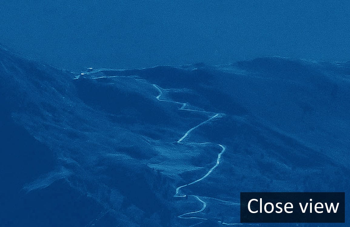 Close view of Serene Blue Mountain Landscape Mural Wallpaper showcasing tranquil scenic design.