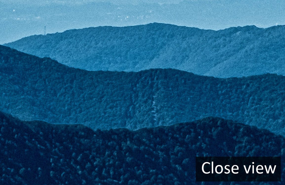 Tranquil Blue Mountain Landscape Mural Wallpaper close-up view, enhancing serene nature Décor mood.