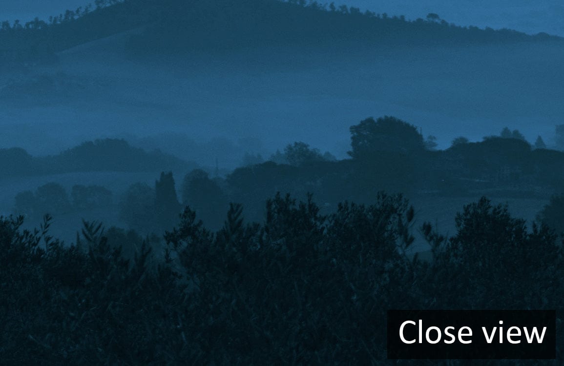 Tranquil Blue Misty Mountains Landscape Mural Wallpaper close view for serene interior design.
