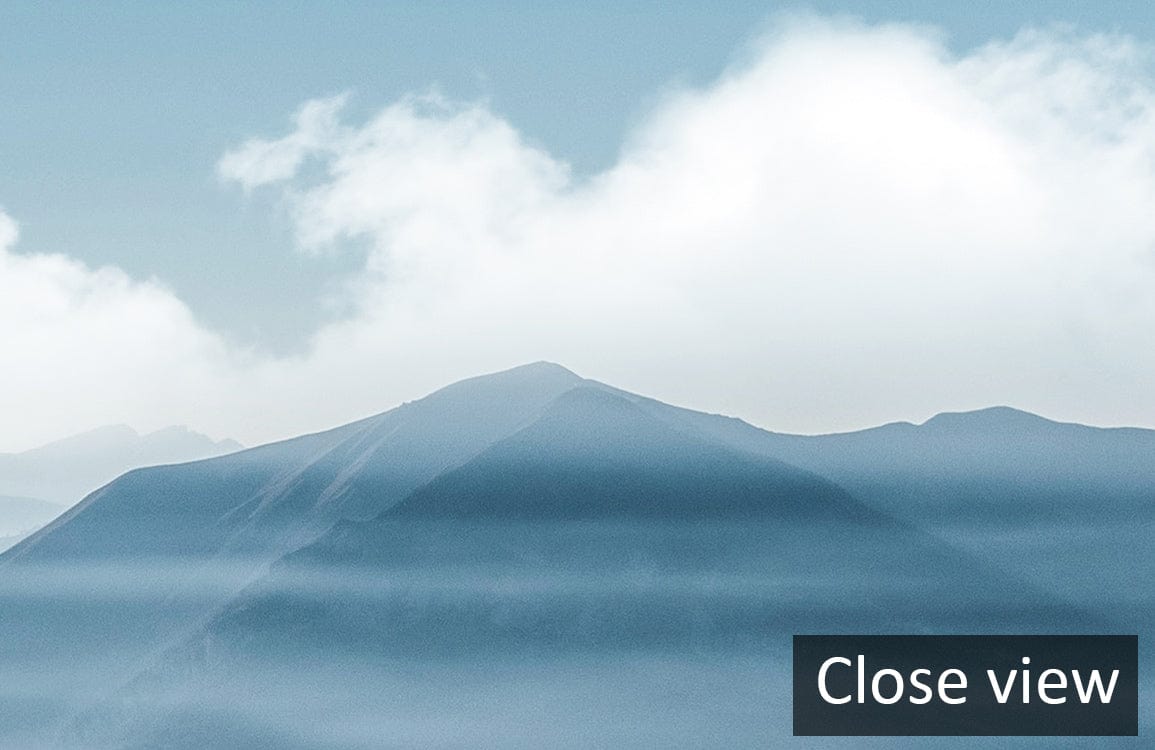 Serene Blue Mist Mountain Landscape Mural Wallpaper with clouds, close view, peaceful decor.
