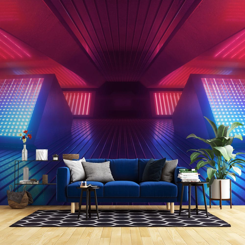 Vibrant geometric mural in blue and pink; modern room with blue sofa, hardwood flooring, abstract rug.