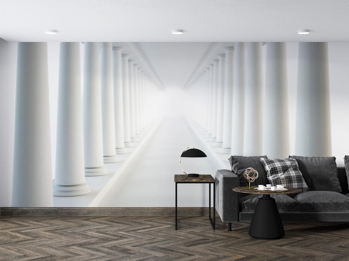 Elegant white pillars illusion mural wallpaper in modern living room, grey sofa, herringbone wood flooring.