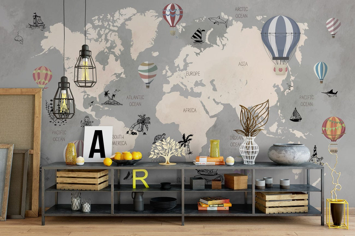 Vintage Adventure World Map Mural Wallpaper with pastel hot air balloons, grey wall, wooden flooring, shelves.