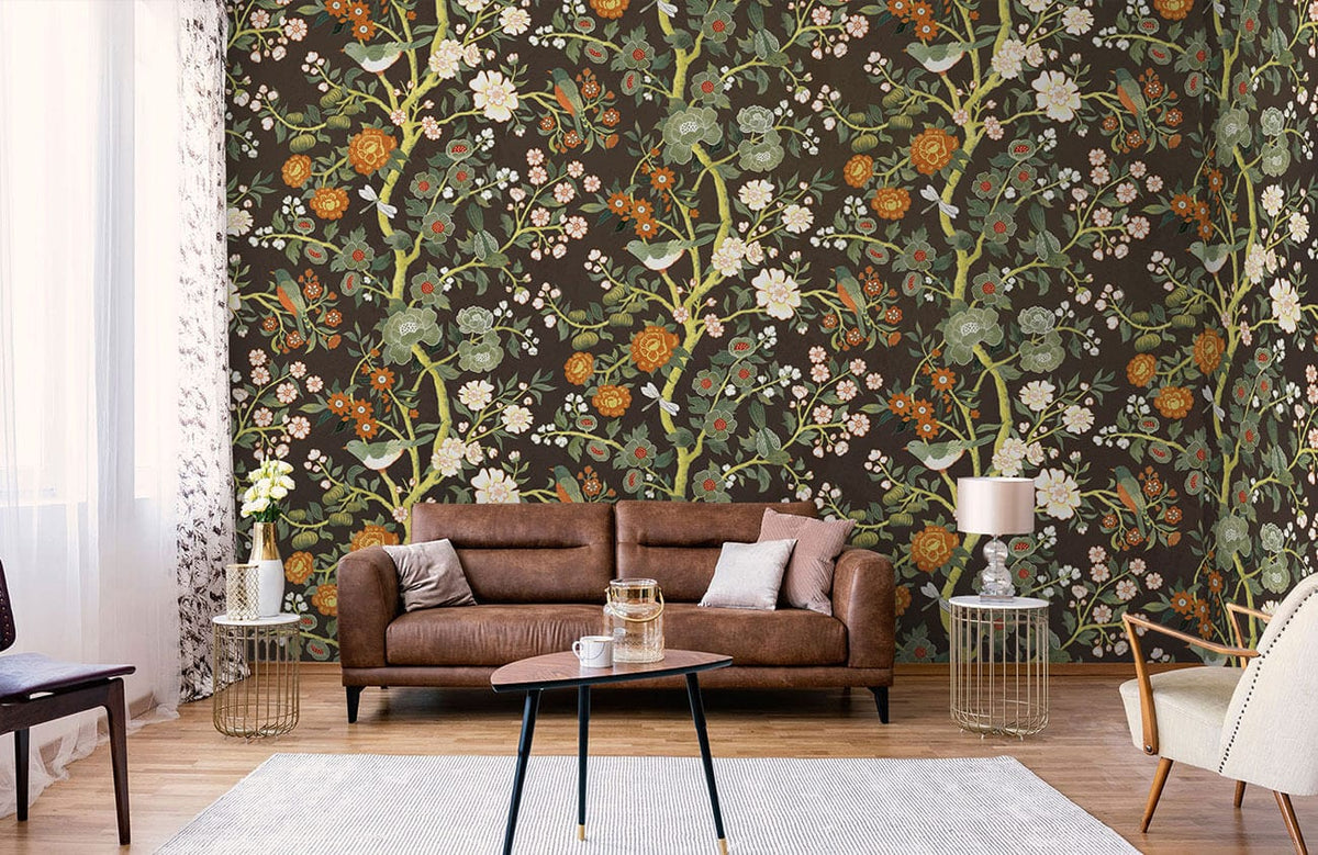 Vintage Victorian floral wallpaper in dark earthy tones with birds, brown leather sofa, modern living room.