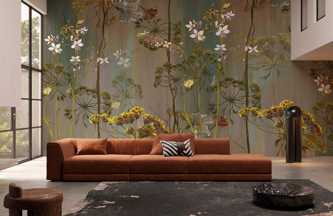 Vintage botanical mural wallpaper in green; brown sofa, modern living room, concrete flooring, elegant decor.