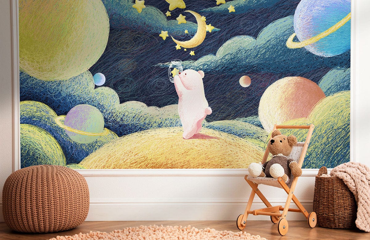 Whimsical Cosmic Bear mural wallpaper in nursery with wooden floor, wicker pouffe, and toy cart.