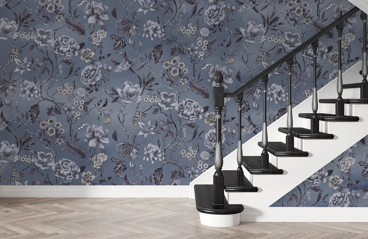 Elegant blue floral wallpaper, vintage botanical charm, black staircase, wooden herringbone flooring, sophisticated decor.