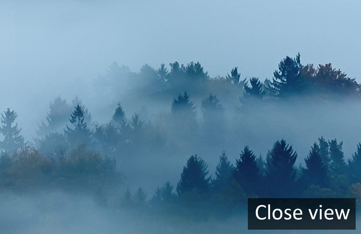 Serene Misty Mountain Landscape Mural Wallpaper in Blue and Gold Tones, close-up. No background details.
