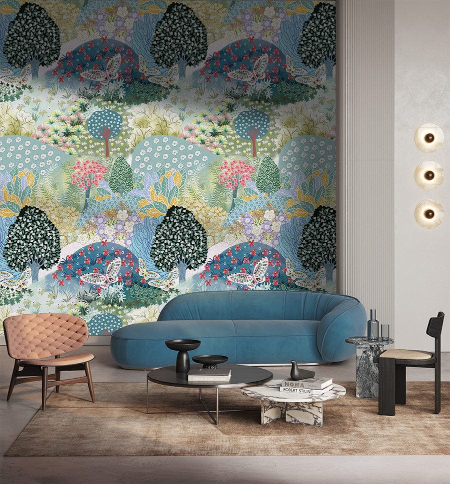 Vibrant pastel woodland wallpaper in stylish living room with blue sofa, modern lighting, and chairs.