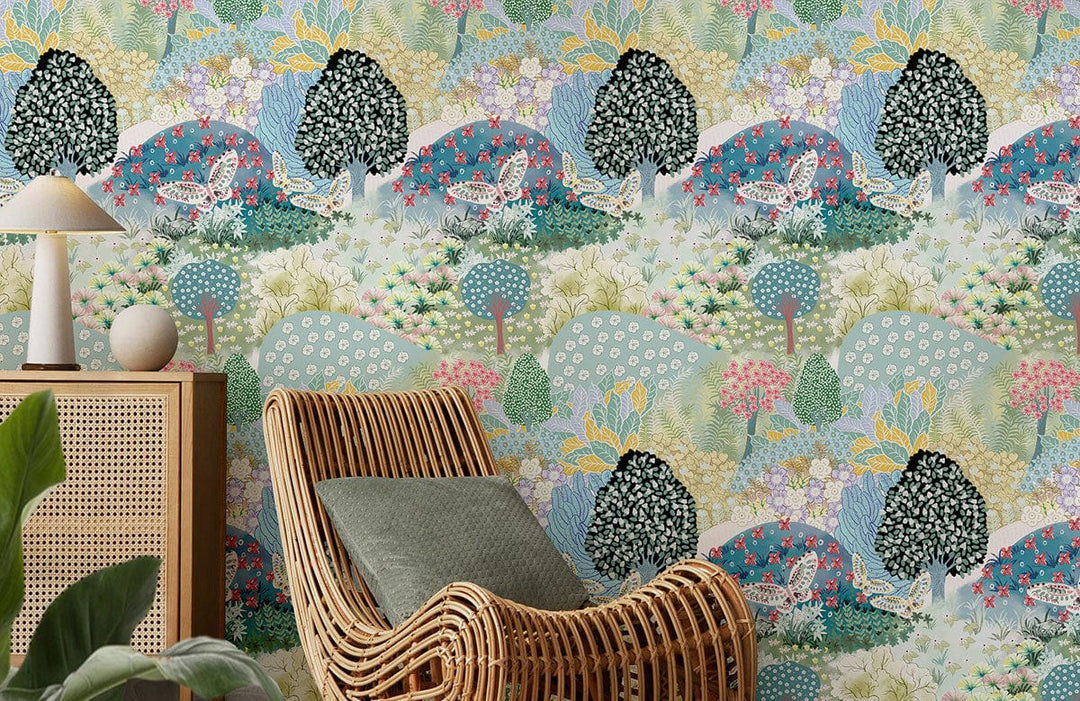 Vibrant pastel woodland wallpaper, rattan chair, light wood furniture, green cushion, modern living room.