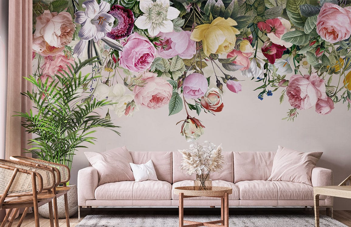 Vintage Floral Blossom Mural Wallpaper in pastel hues with pink sofa, wicker chair, and elegant decor.