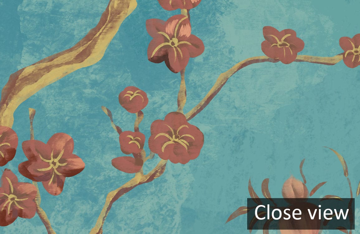 Close-up of elegant turquoise floral mural wallpaper featuring birds and pink blossoms, detailed view.