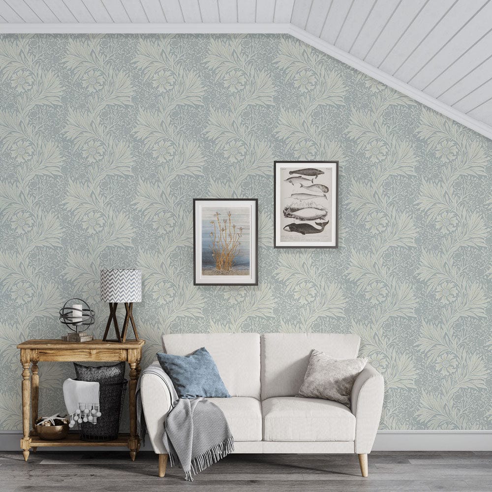 Elegant vintage floral sage green wallpaper with cream sofa, wooden side table, and framed wall art.