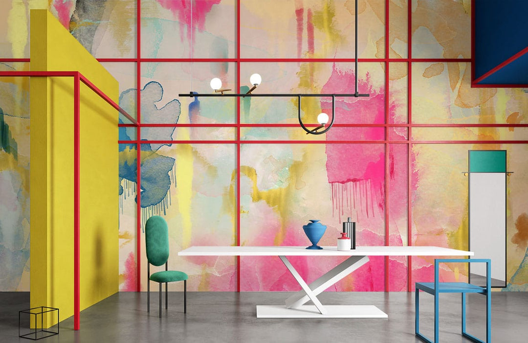 Vibrant abstract mural wallpaper, colourful splashes; modern dining room, white table, teal and blue chairs.