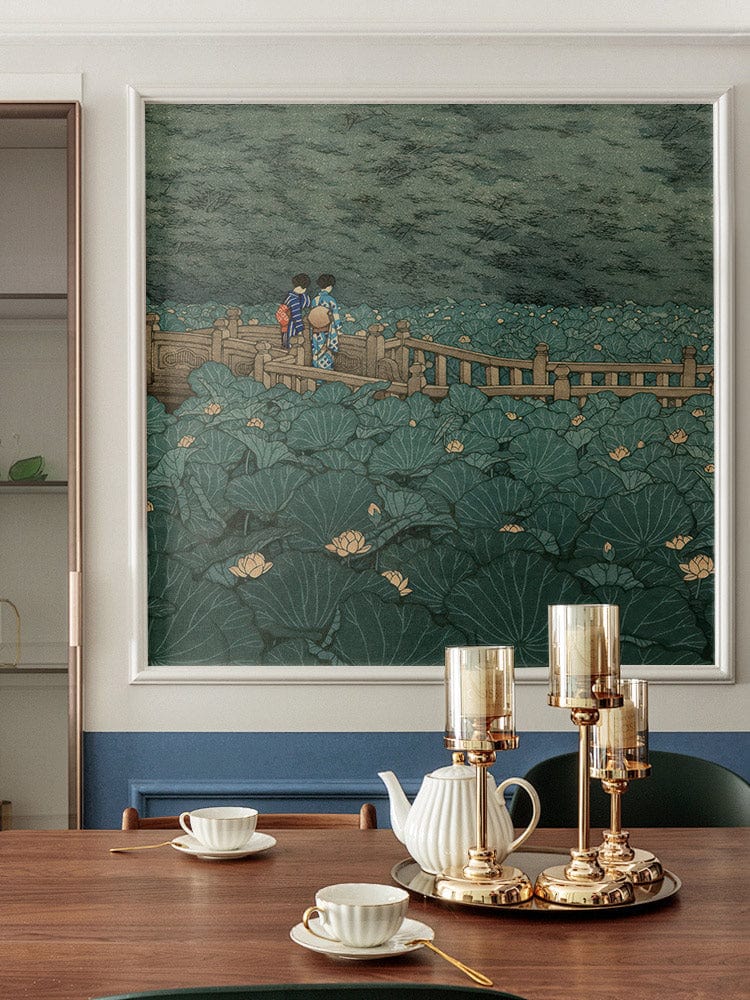 Serene Green Lotus Garden Mural Wallpaper in dining room with wooden table, green chairs, and gold accents.