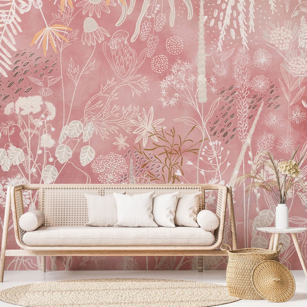 Rustic blush floral mural wallpaper, natural motif, light sofa, woven rug, in a bohemian living room.