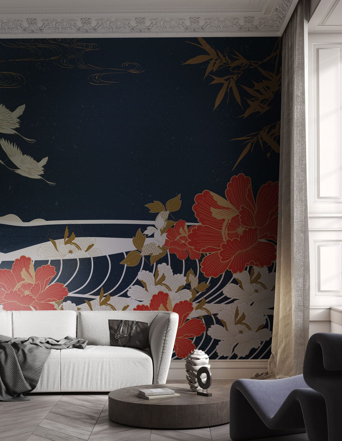 Japanese Crane Mural Wallpaper features red florals, light sofa, dark armchair, and wood chevron flooring.