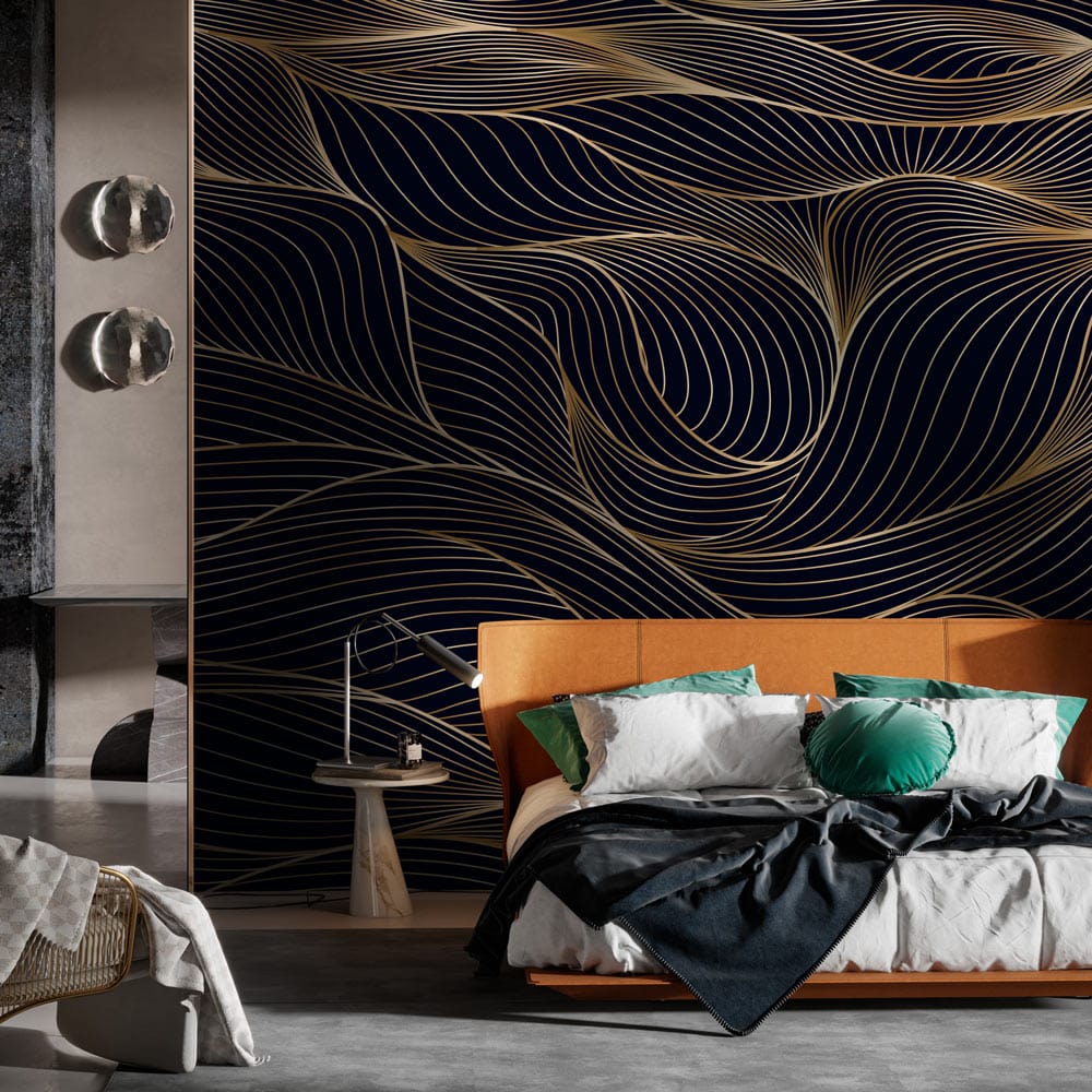 Elegant black and gold wave wallpaper in modern living room with orange sofa and grey flooring.