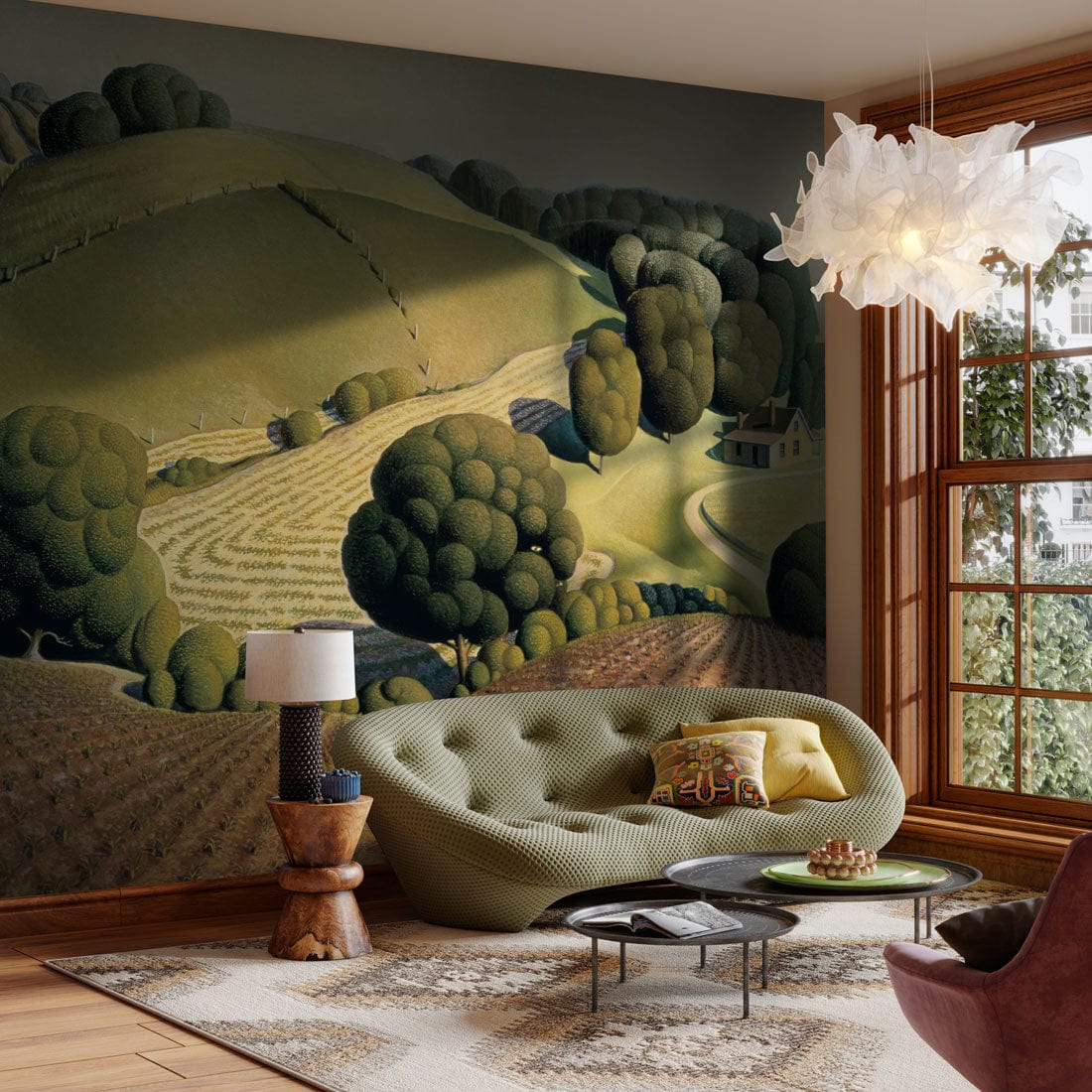 Vintage pastoral landscape mural in green tones with plush sofa, modern coffee table, wooden flooring.