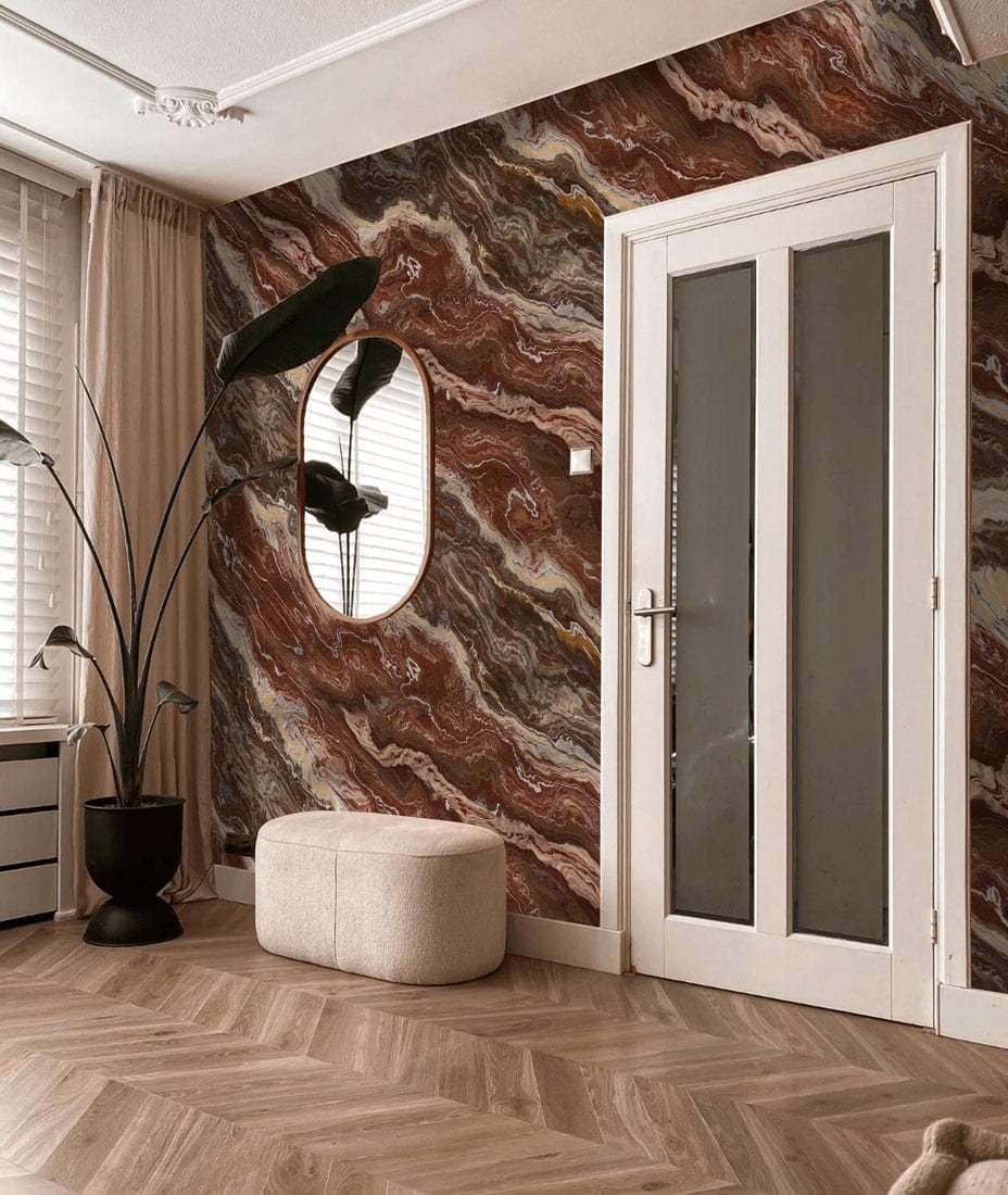 Rustic Earth Marble Effect Wallpaper in room with beige pouffe, wooden herringbone floor, black plant pot.