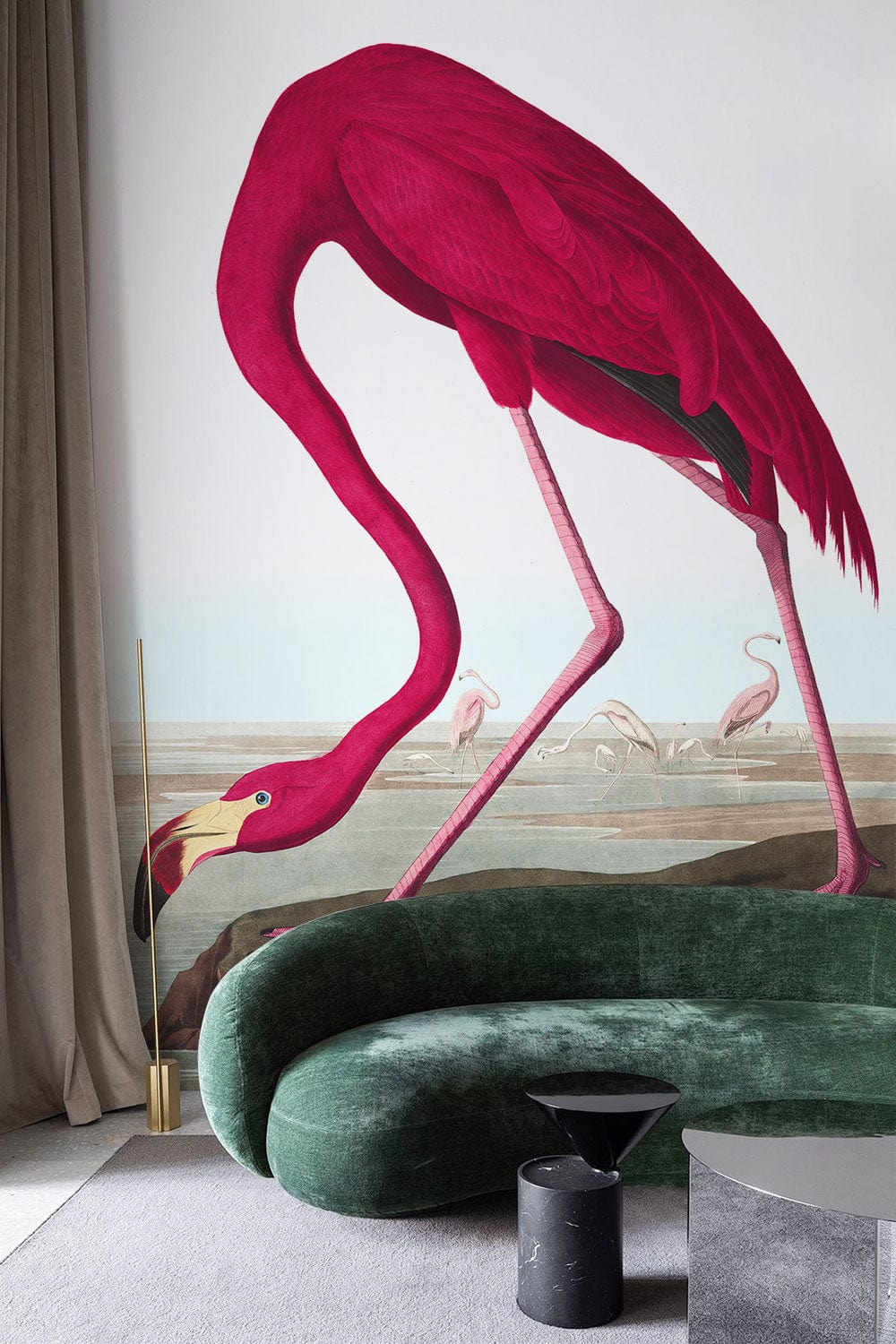 Elegant pink flamingo mural wallpaper, green curved sofa, stylish interiors, neutral floor, modern living room.