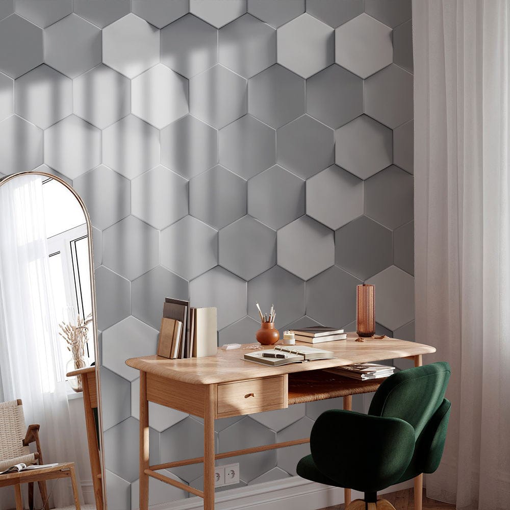 Modern grey hexagonal geometric wallpaper in contemporary room with green chair and wooden desk.