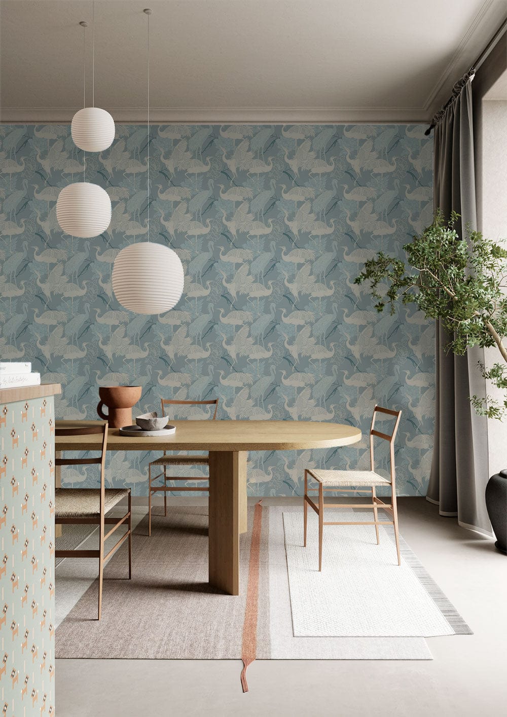 Elegant dining room with sky blue origami cranes wallpaper, wooden table, modern chairs, geometric ceiling lamps.