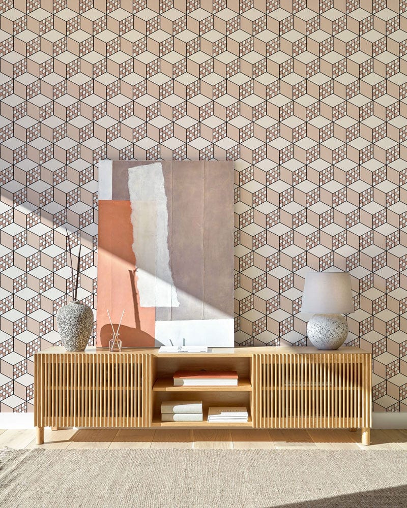 Geometric taupe and white 3D cube wallpaper with wooden sideboard, modern artwork, and ceramic decor.