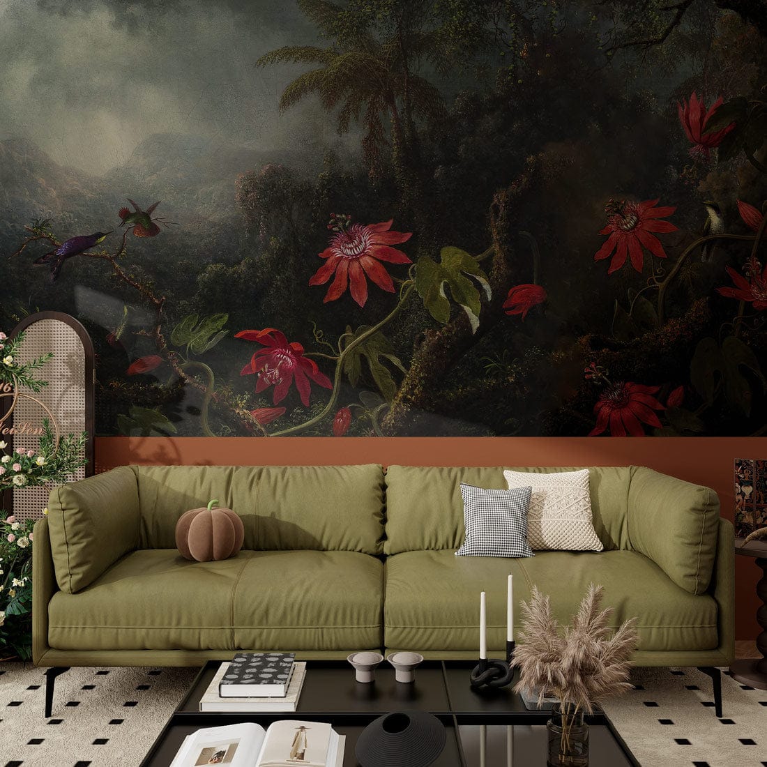 Vintage tropical mural wallpaper with exotic red flowers, green foliage, olive sofa, glass coffee table.