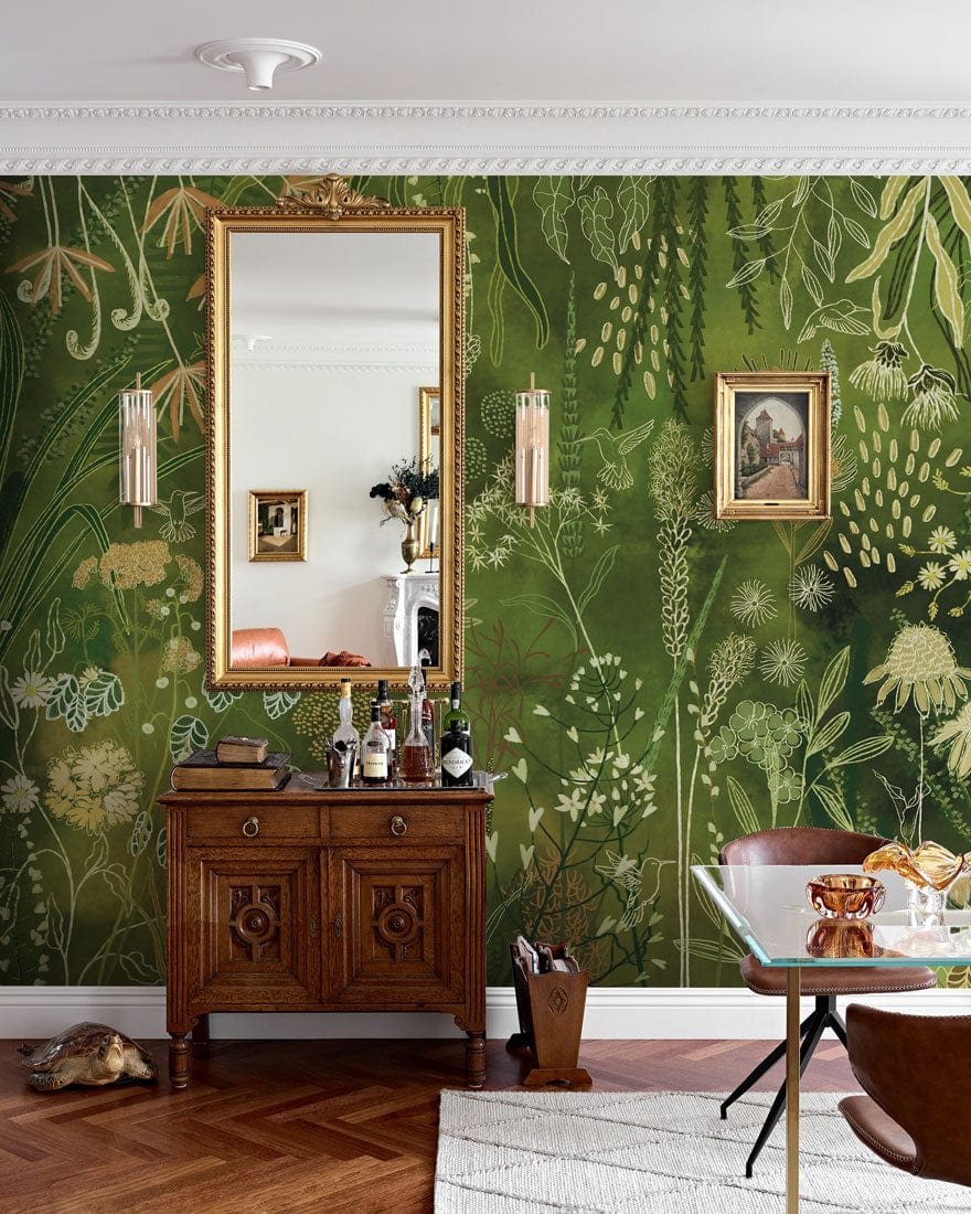 Luxurious green botanical garden mural wallpaper in elegant living room with vintage wooden cabinet, mirror.
