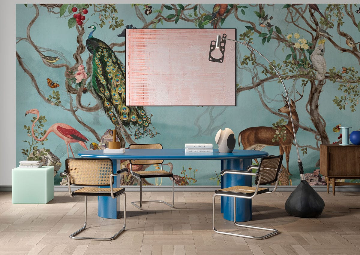 Vintage Pastel Woodland Mural Wallpaper, vibrant dining room, blue table, modern chairs, wooden flooring.