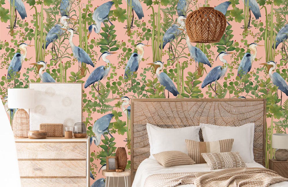 Exotic Blue Heron Botanical Wall Mural in bedroom with rattan bed, wooden dresser, and woven lamp.