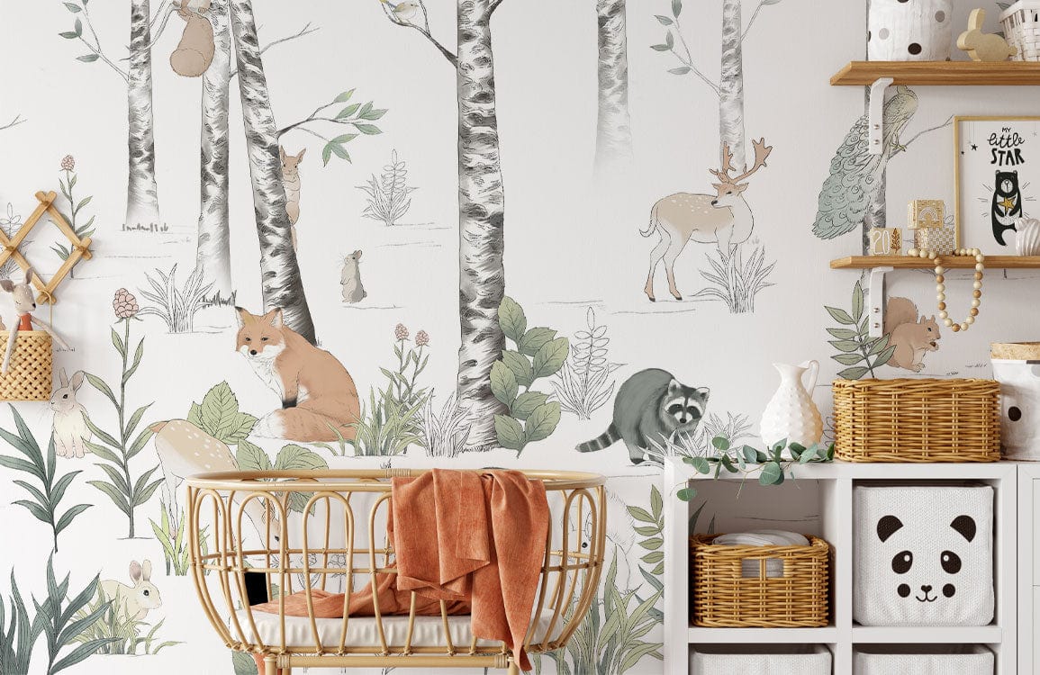 Whimsical woodland creatures mural wallpaper in pastel tones, nursery room with wicker cot and storage.