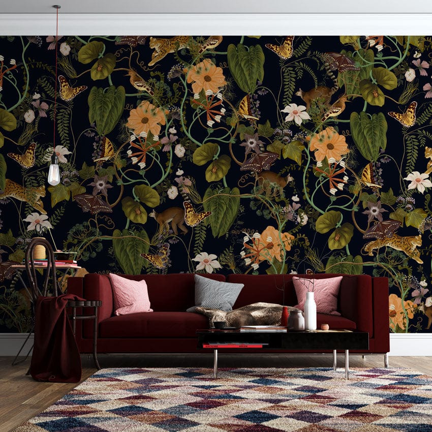 Luxury Botanical Mural Wallpaper in living room with stylish red sofa, geometric rug, hardwood flooring.