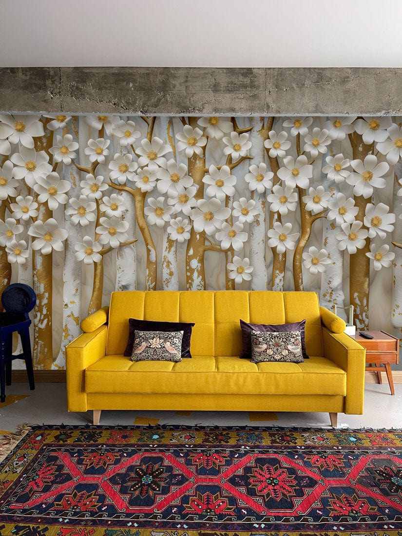 Yellow sofa against Luxurious Gold and White Floral 3D Mural Wallpaper, featuring vibrant area rug.