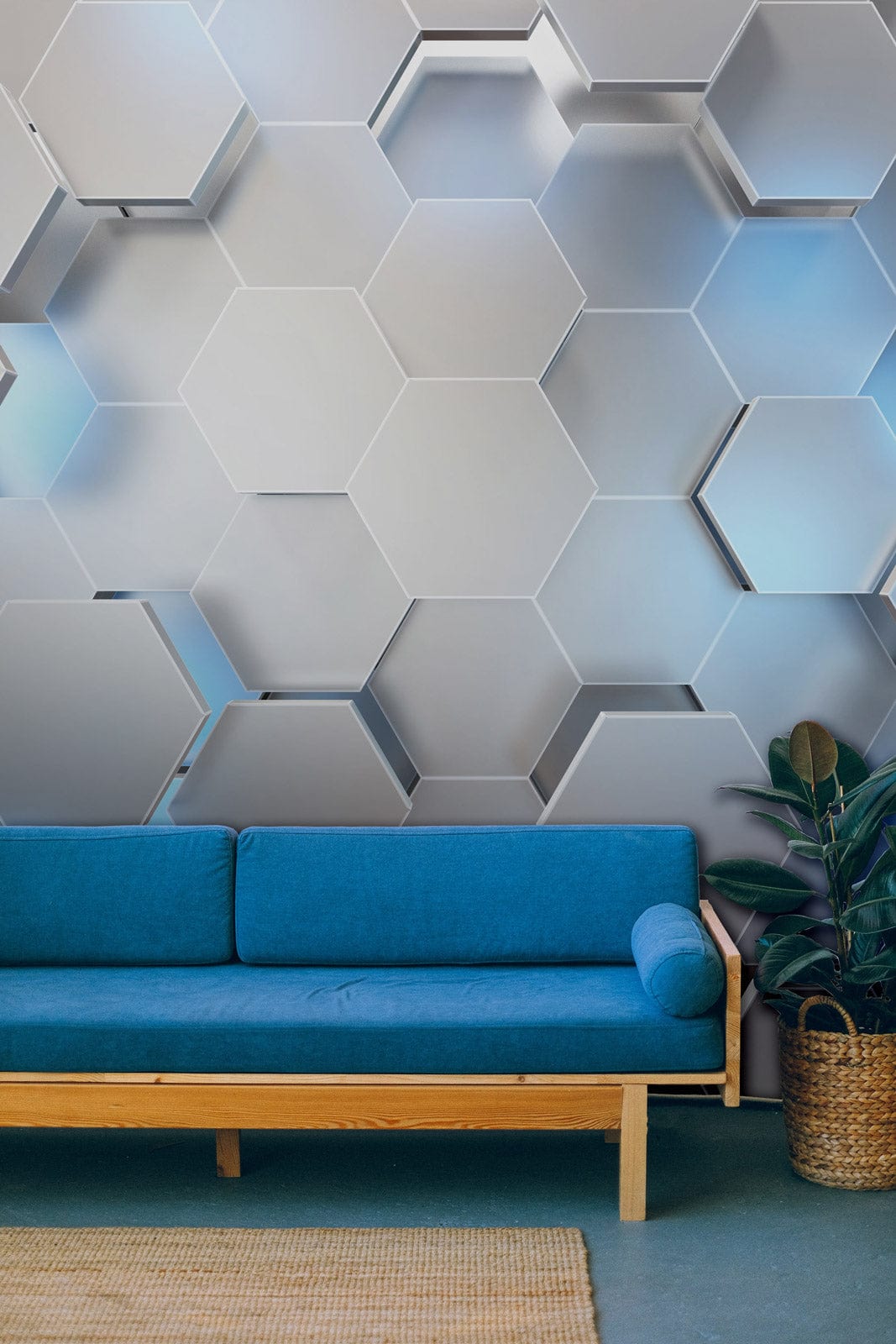 Blue sofa with Modern Hexagonal Geometric Silver and Blue 3D wallpaper, wicker plant basket, rug.
