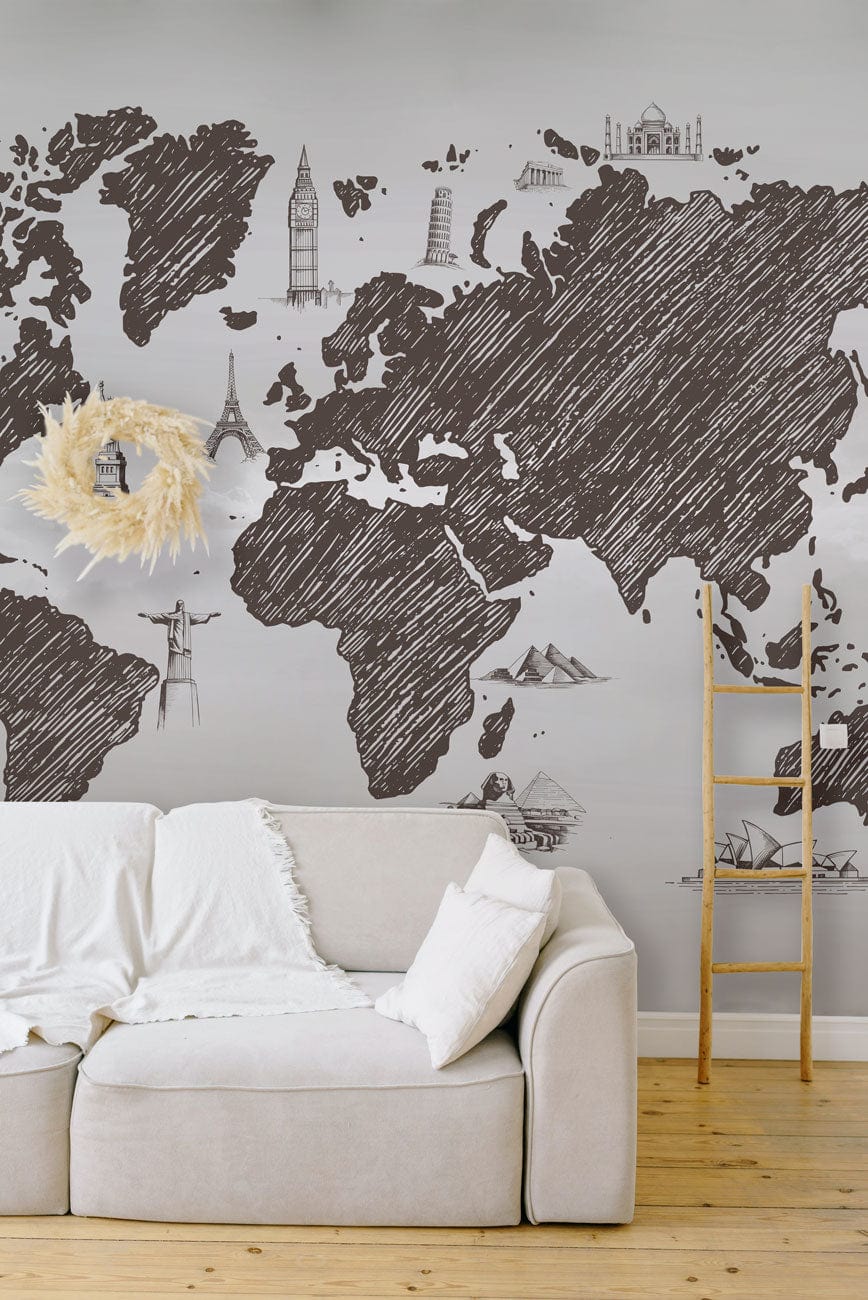 Vintage Sketch World Map Mural Wallpaper in Charcoal Grey, beige sofa, light wood floor, minimalist decor.