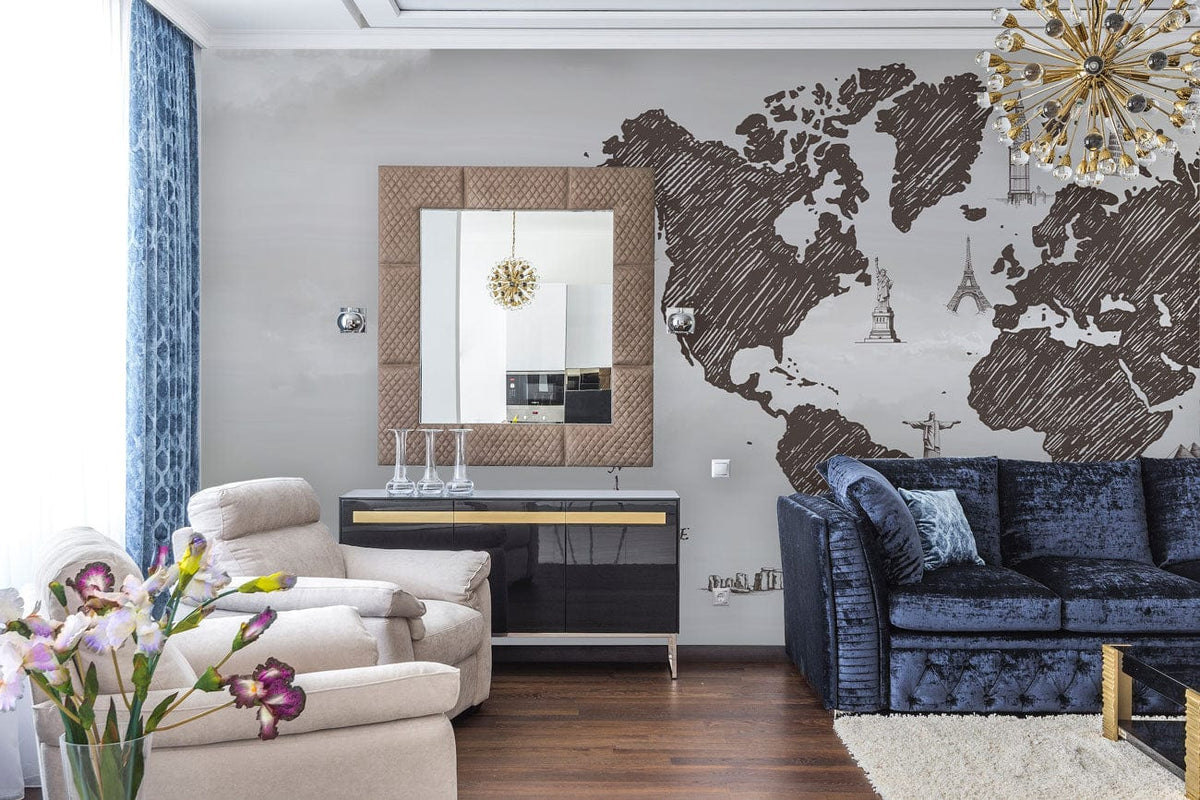 Vintage Sketch World Map Mural in stylish living room, beige armchair, blue sofa, hardwood floor.