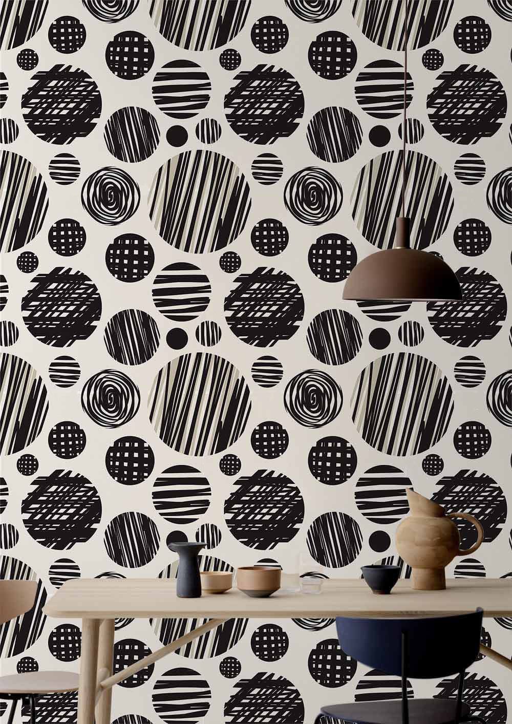 Monochrome geometric circle wallpaper with wooden table, elegant pendant light, and contemporary dining room decor.