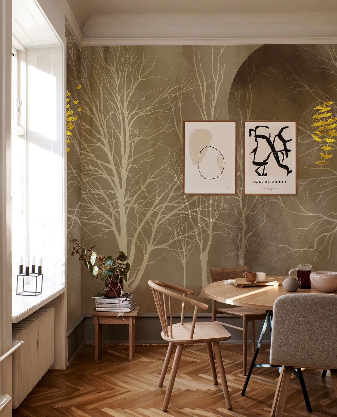 Golden Autumn Forest Mural Wallpaper featuring elegant earthy tones, dining room with wooden chairs, parquet flooring.