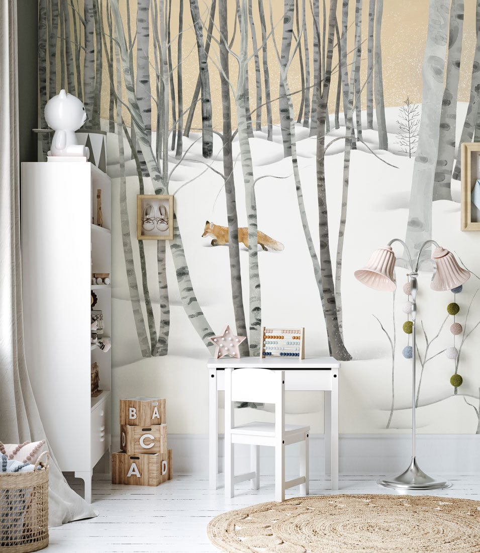 Winter Wonderland Birch Forest Mural Wallpaper with fox, white table, chair, and floor lamp in nursery.