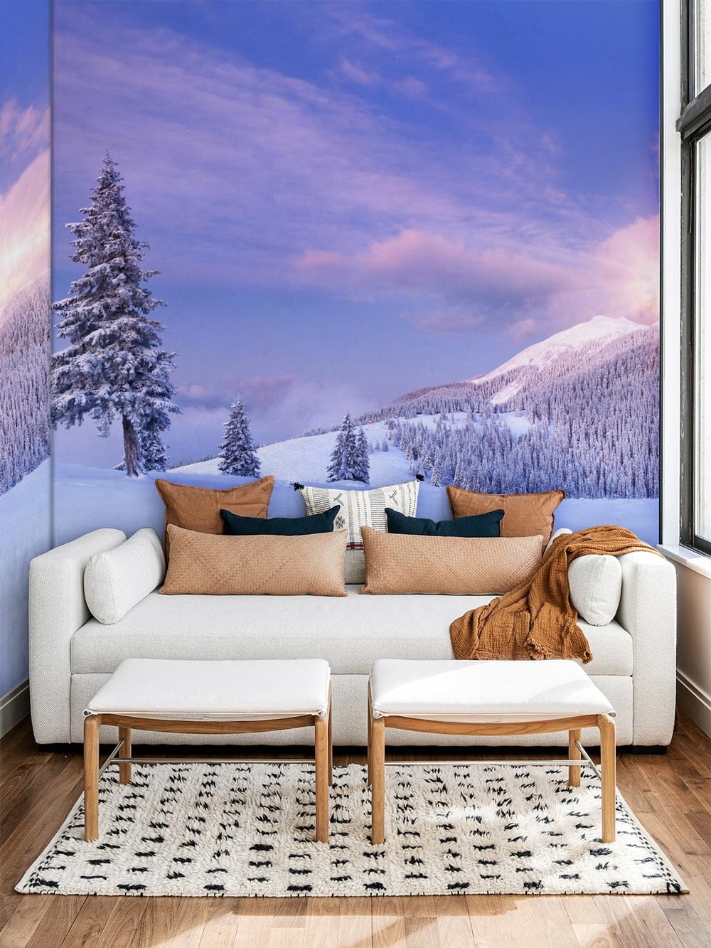 Modern living room with Tranquil Winter Dawn Mural, white sofa, hardwood flooring, and Nordic-style decor.