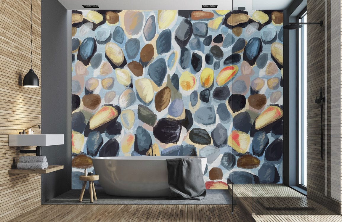 Contemporary mural wallpaper with multicoloured pebble pattern, freestanding bathtub, modern bathroom decor, wooden flooring.